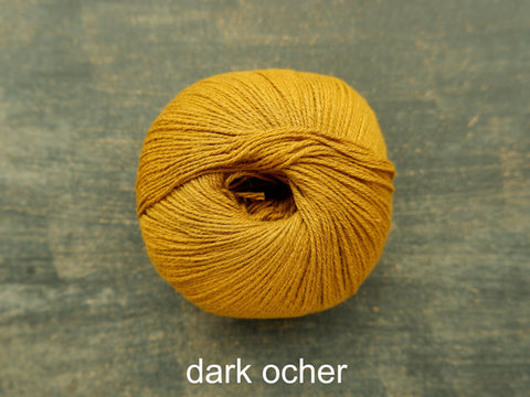 Knitting For Olive's Cotton Merino is a fine ,fingering weight yarn . Dark Ocher