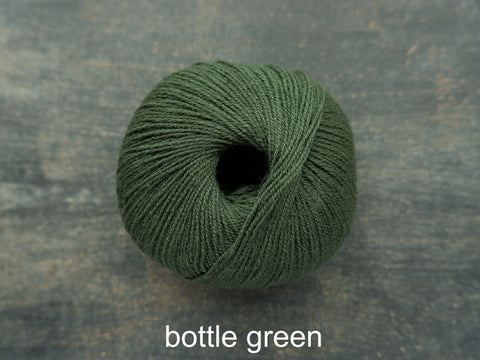 Knitting For Olive Merino. A fine fingering weight yarn. Bottle Green