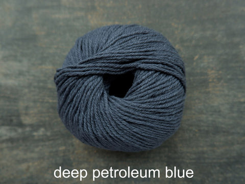 Knitting For Olive's Heavy Merino is a worsted weight yarn. Deep Petroleum Blue