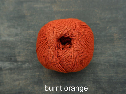 Knitting For Olive Merino. A fine fingering weight yarn. Burnt Orange